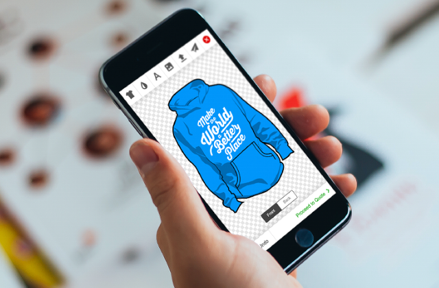 Man holding smartphone with LiveArt Html5 designer and designing hoodie