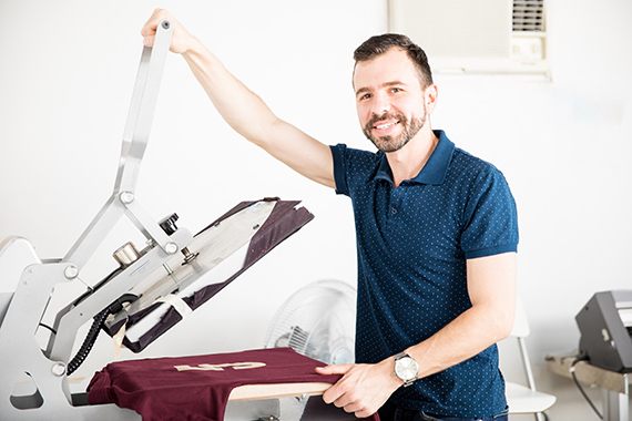 Man standing near designed t-shirt