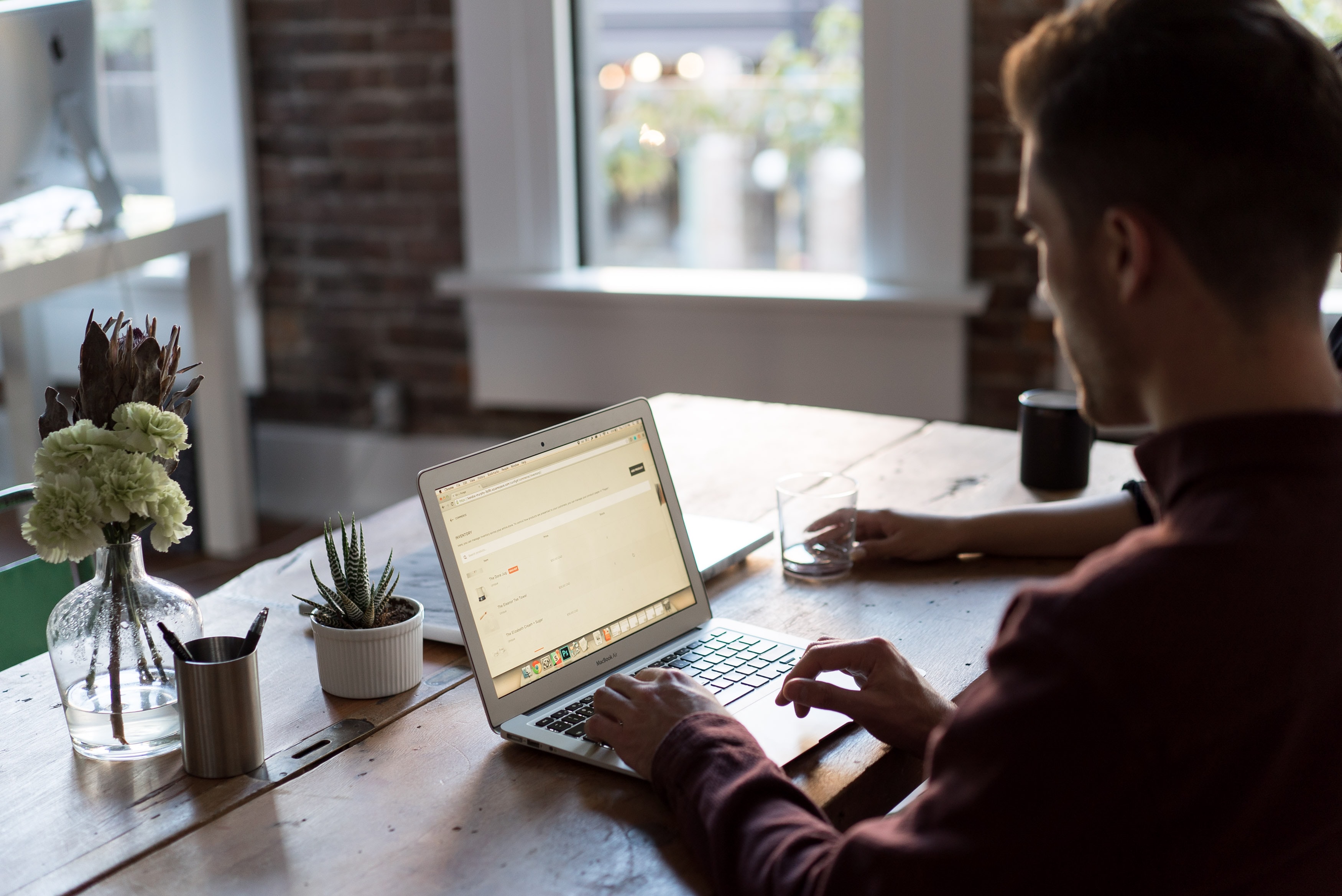 Businessman sitting in the front of the laptop and working from home